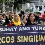 Faculty Regent Early Sol Gadong (second from left) joins progressive leaders in the protest march to commemorate the 39th anniversary of EDSA People Power uprising. (OFR Photo)
